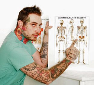 Tattooed doctor showing anatomy chart